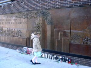 Little girl at the Firefighters Memorial near Ground Zero in New York