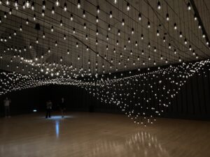 An art installation of lights that form arcs and undulate