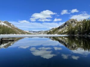 Echo Lake, near Lake Tahoe. The clouds are reflected in the water.